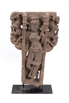A shrine of Buddhist gods carved into rock, India about the 11th-12th century. A fragment from 