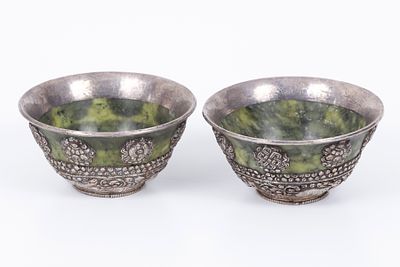 A pair of Tibetan bowls made of jade combined with silver. A pair of Tibetan bowls made ojade 