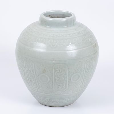 A porcelain vase decorated with celadon glaze - Qing Dynasty (1644–1912). And a porcelain vase 