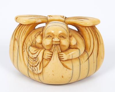 An old Natsuki in the form of Hotei, 19th century Japan. A figure from the Japanese tradition, a 