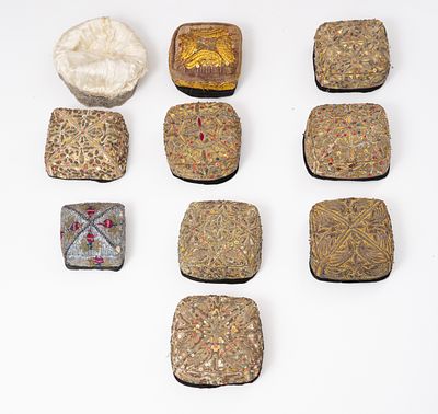 An impressive lot of Bukhari yarmulkas embroidered with silver and gold threads. yarmulkas 