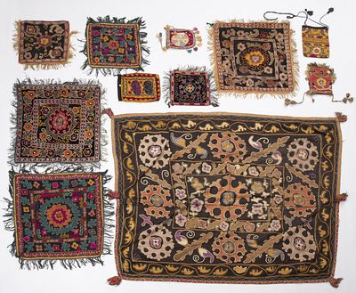 A diverse lot of old embroiederies, Uzbekistan. A variety of square fabrics for pillows. and 
