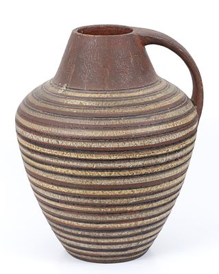 Ceramic art - over sized . Decorated with a striped motif in shades of brown, black and white 