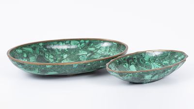 A pair of bowls made of malachite stones and brass. A pair of elegant bowls made of carved and 