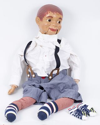 AN ANTIQUE DUMMY PUPPET. Operating the doll with a thread from the back (color falls, and minor 