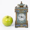 An old Victorian traveling clock decorated with enamel paintings. The movement was changed to a Image - 1