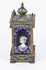 An old Victorian traveling clock decorated with enamel paintings. The movement was changed to a Image - 4