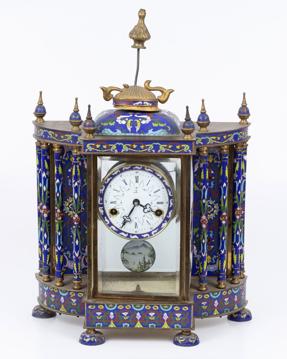 An old mantel clock decorated with a Chinese cloisonne , remnants of gold plating. An impressive 
