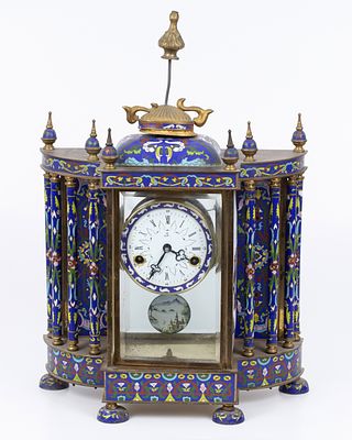 An old mantel clock decorated with a Chinese cloisonne , remnants of gold plating. An impressive 