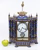 An old mantel clock decorated with a Chinese cloisonne , remnants of gold plating. An impressive Image - 1