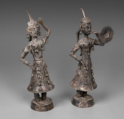A Pair of Silver Figurines, Burma, 20th Century. Set on circular bases and designed as a dancer 