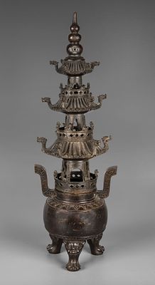A Bronze Incense Burner, China, 20th Century. In pagoda form, raised on four supports with 
