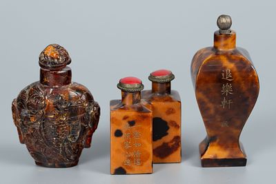 A Lot of Three Chinese Tortoiseshell and Amber Snuff Bottles. Two tortoiseshell bottles 
