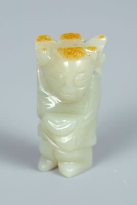 A Celadon Jade Figurine, China. Carved from celadon jade in a pale green tone, depicting a 
