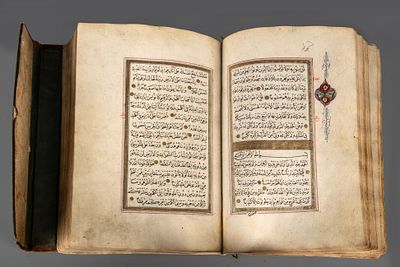 An Illuminated Hand Written Quran, 18th Century. Bound in in an embossed parcel gilt leather 