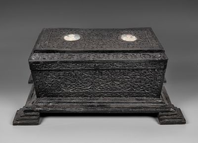A Colonial Carved Ebonized Wood Hope Chest, Anglo-India, Late 19th Century. Set on four tiered 