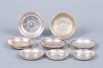 A Set of Eight Ottoman Silver Saucers, Early 20th Century. Each centered with an inset Ottoman 