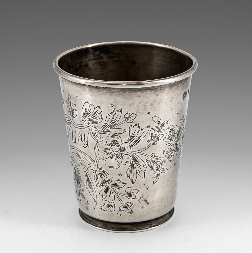 A Silver Beaker, Ottoman Empire, 19th Century. The sides engraved with flowers and scrolling 