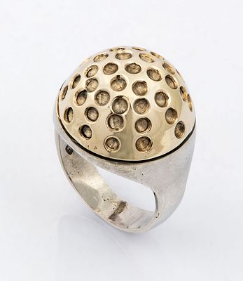 A Designer 14K Gold and Sterling Silver Ring. The head designed as a dome studded with hammered 