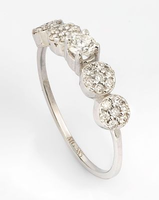 A 14K White Gold and Diamond Ring. The top set with a row of brilliant cut diamonds (approx. 