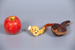 A Pair of Carved Amber and Meerschaum Pipes, 19th Century. Comprising two pipes: 
1. A memento Image - 1