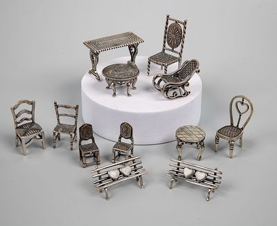 A Mixed Lot of Silver Miniature Furniture Models. Comprising various miniature silver furniture 