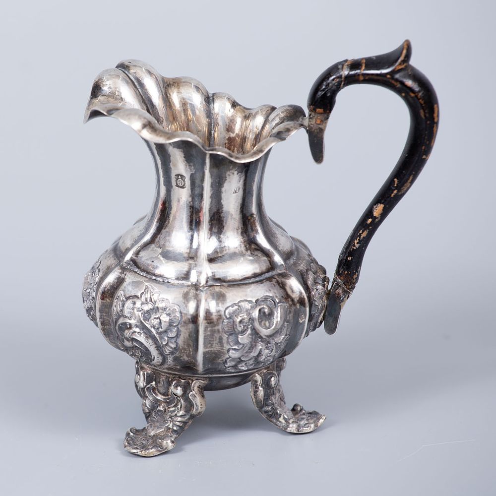 A Fine Silver Cream Jug, Austria, Alt Wien, 1850. Raised on four palmette shaped feet, the 