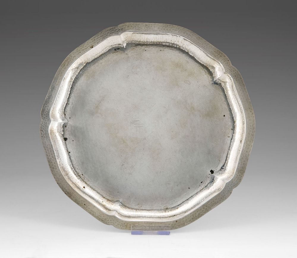 A Silver Tray, Germany, Late 19th Century. Circular form with a scalloped floral rim, the 