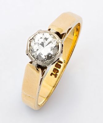 A 18K Gold Diamond Solitaire Ring. Centered with an old European cut diamond (approx. 0.2 Ct). 