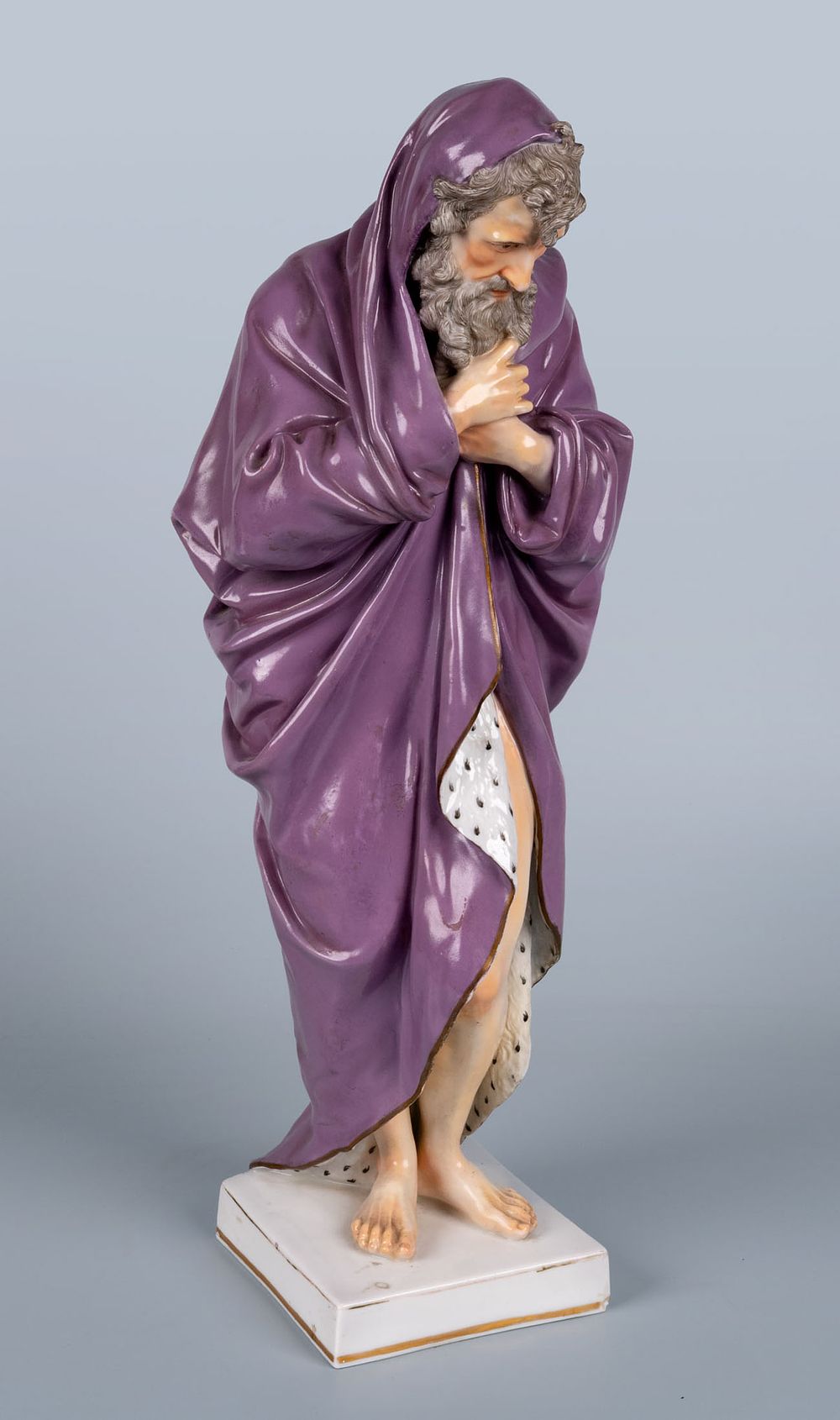 A Hochst Porcelain Figure of a Man in a Robe, Germany, 19th Century. Depicting a male figure 