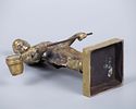 A Pair of Gilt Bronze Blacksmith Figurines. Heights: 30 cm / 20 cm. 
Condition: For a full Image - 4