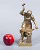 A Pair of Gilt Bronze Blacksmith Figurines. Heights: 30 cm / 20 cm. 
Condition: For a full Image - 5