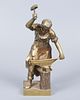 A Pair of Gilt Bronze Blacksmith Figurines. Heights: 30 cm / 20 cm. 
Condition: For a full Image - 6