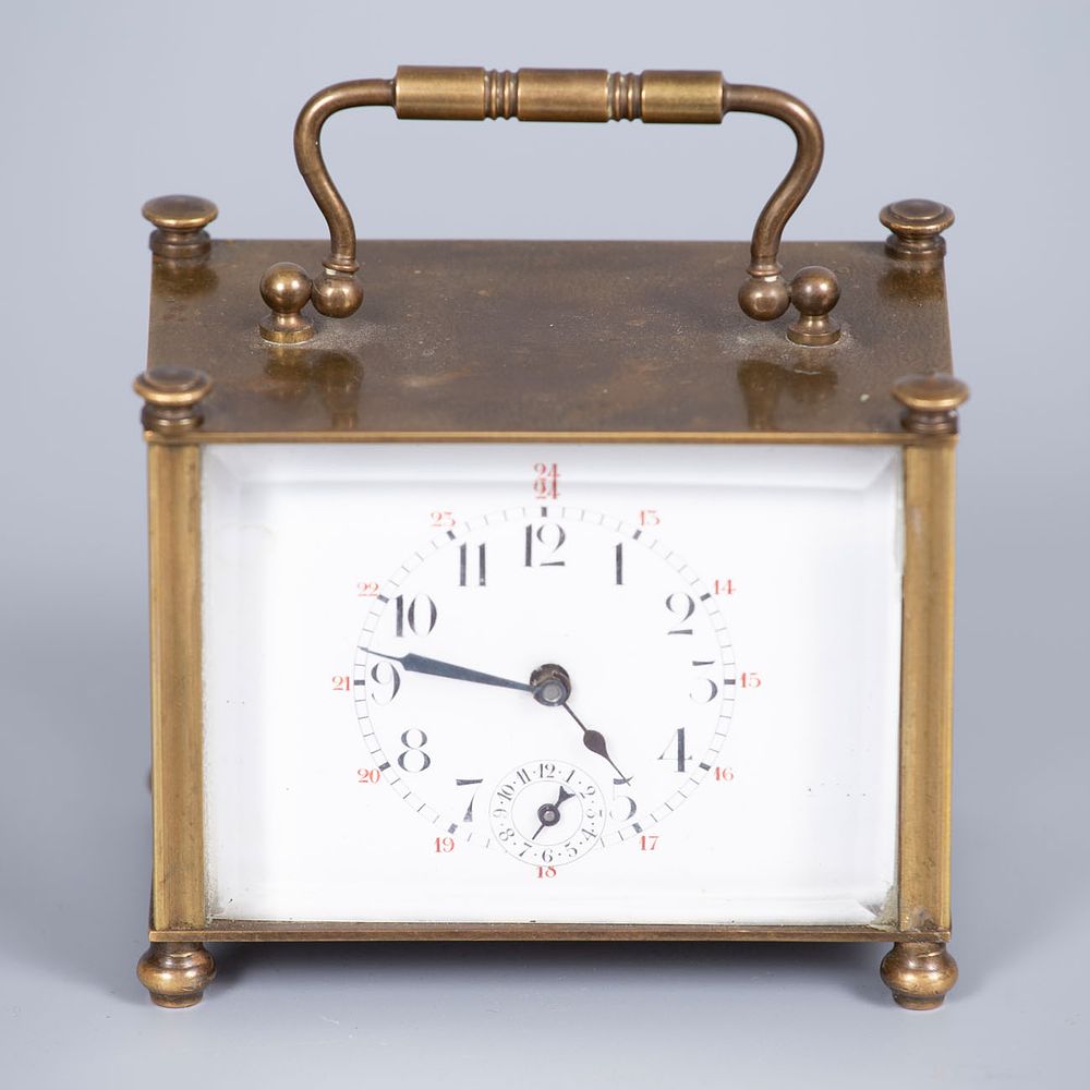 A Brass Carriage Clock, 19th Century. Rectangular structure with clean lines terminating in 