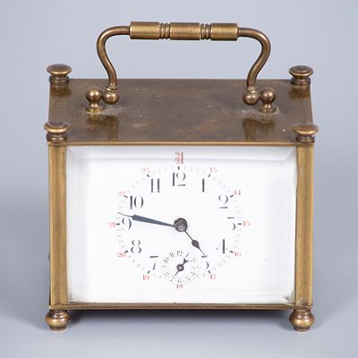 A Brass Carriage Clock, 19th Century. Rectangular structure with clean lines terminating in 
