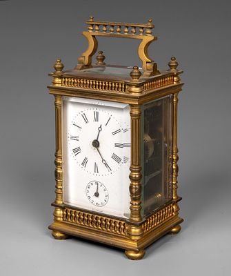 A Brass Carriage Clock, Europe, Late 19th. Architectural case with fluted columns, a decorative 
