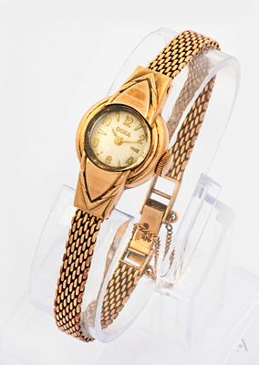A Doxa 14K Rose Gold Ladies' Wristwatch, 1970s. Movement: Mechanical Case: Round 14K rose gold 