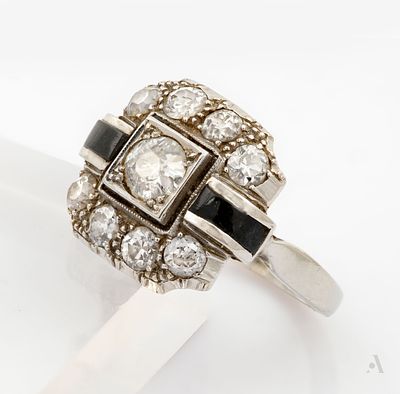 An Art Deco 14K White Gold Diamond and Black Enamel Ring. The head centered by a square setting 
