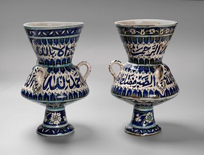 A Pair of Iznik-Style Porcelain Vases, probably Syrian early 20th c . Each decorated in the 