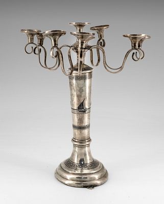 A Silver and Niello Hanukkah Lamp, Iraq, Early 20th Century. A circular tiered base ornamented 