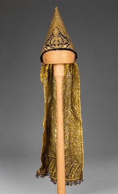 An Embroidered Headdress (Duka), Tunisia, Circa 1900. Of conical form in dark velvet 
