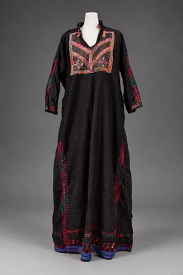 An Embroidered Satin Thobe Dress, Palestine, Early 20th Century. Of black satin, decorated 