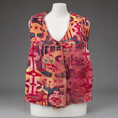 An Ikat Velvet Vest, Bukhara, Early 20th Century. The fabric in shades of purple and yellow. 