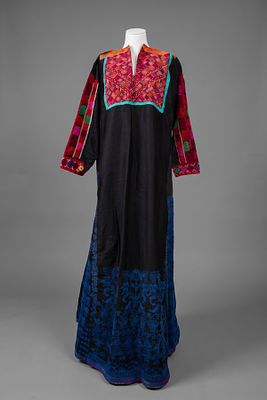 An Embroidered Dress, Palestine, Upper Galilee, Early 20th Century. Of black fabric with a front 