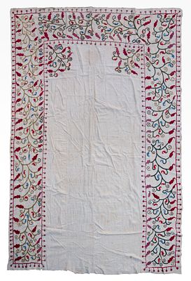 A Suzani Embroidery, Uzbekistan, Late 19th Century. The borders embroidered with colorful floral 