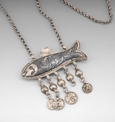 A Silver Amulet Necklace, Palestine, Early 20th Century. The amulet designed as a fish with 