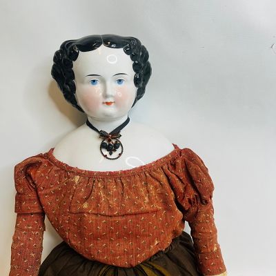 Large China Head Doll with Leather Hands, approx. 30 inches, clothes in fragile condition with 