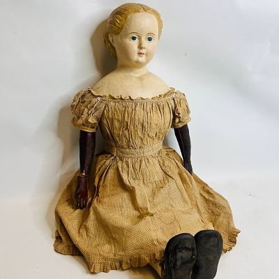 Antique Paper Mache Doll is approx. 32 inches with leather arms and hands in poor condition. 