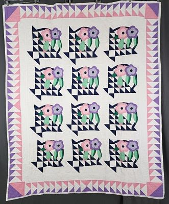 Vintage c 1940s Flower Basket Quilt measuring 63"x78". Lovely pink and purple flying geese 
