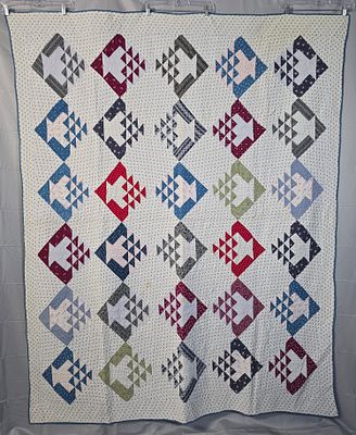 Antique c1890 Basket Quilt measuring 63 by 80 inches. It is comprised of 30 basket blocks, 8.5 